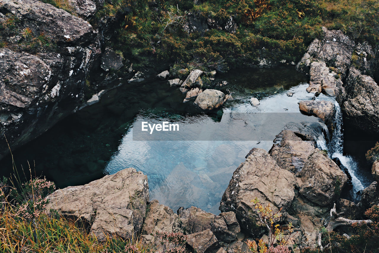 High angle view of rocks by fairy pools