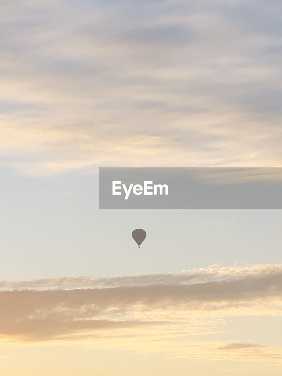 Low angle view of hot air balloon against sky during sunset