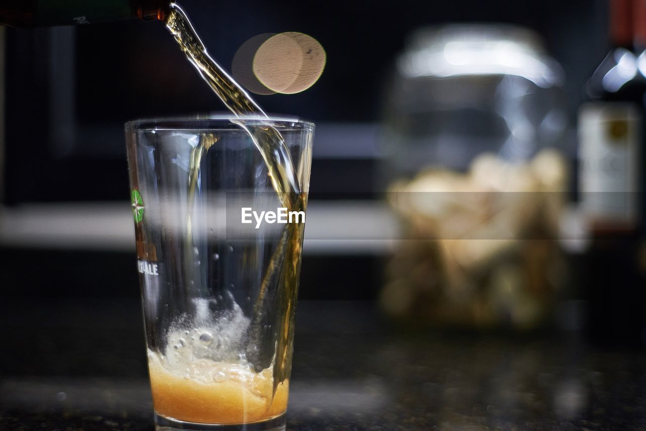 Close-up of beer glass on table