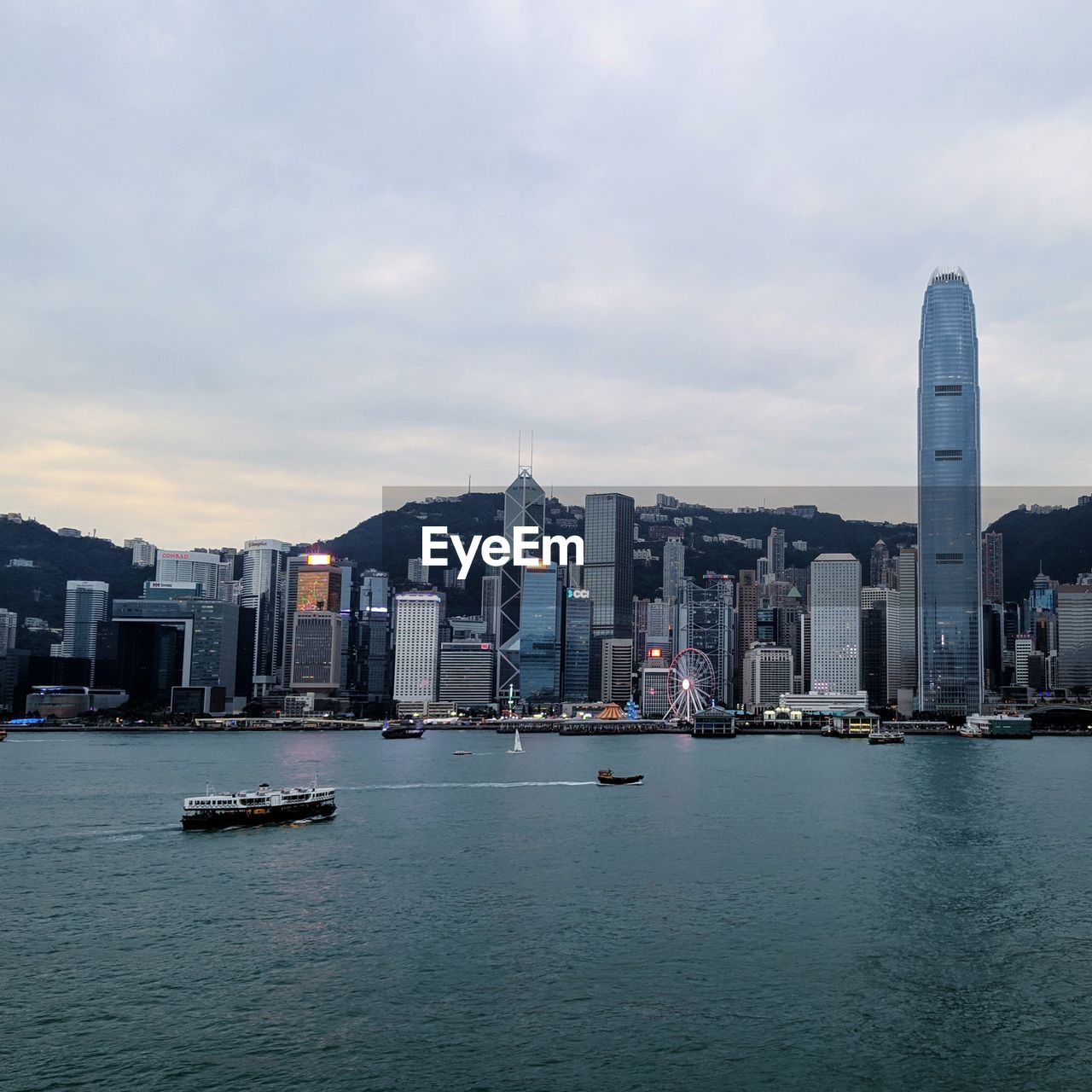 SCENIC VIEW OF SEA BY BUILDINGS AGAINST SKY