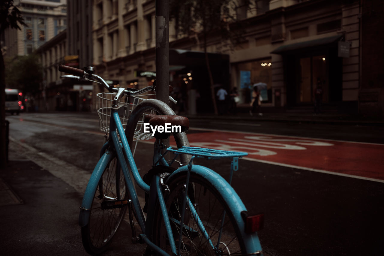 Bicycle parked on street in city