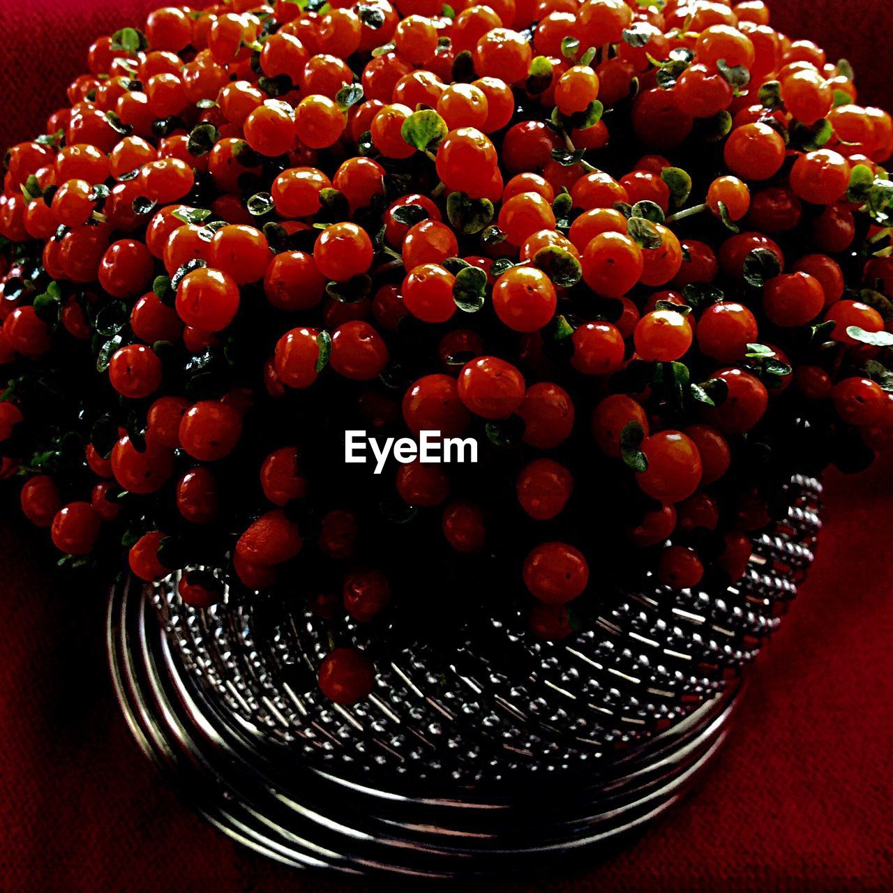 Close-up of artificial cherries on table