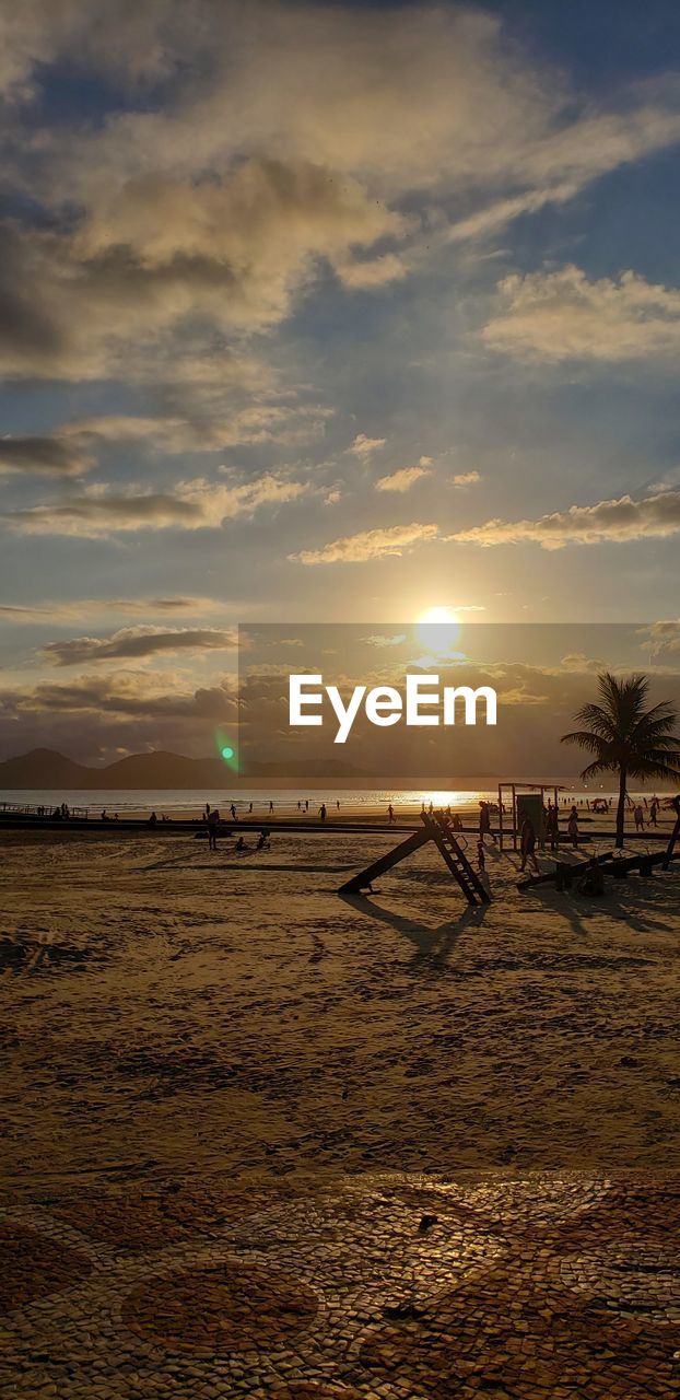 SCENIC VIEW OF BEACH DURING SUNSET