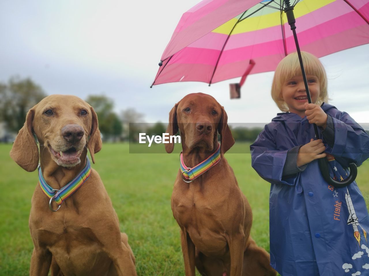 PORTRAIT OF WOMAN WITH DOG WITH UMBRELLA