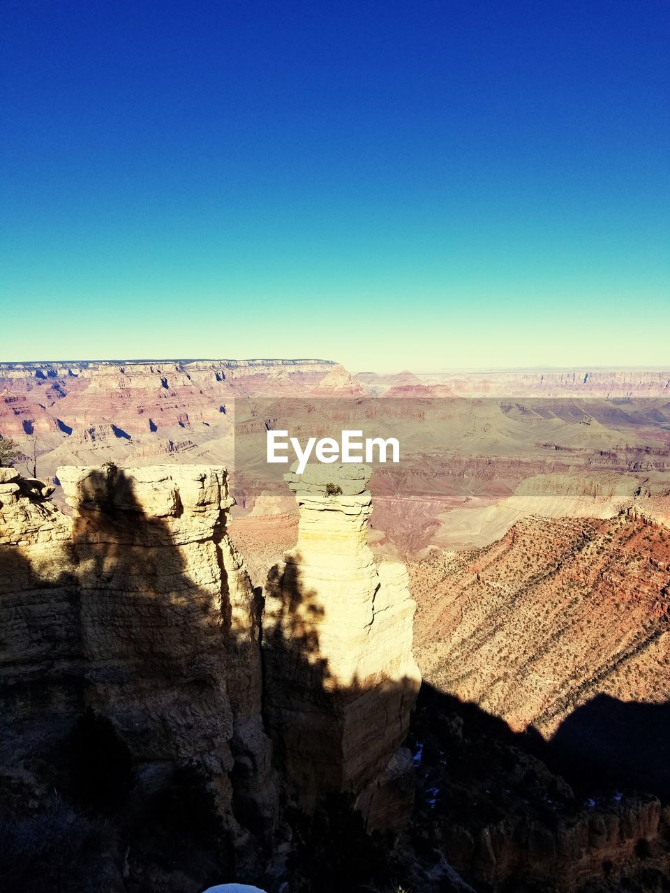 SCENIC VIEW OF DRAMATIC LANDSCAPE AGAINST BLUE SKY