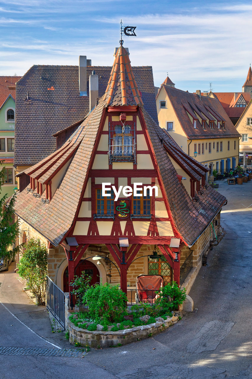 Houses in town against sky