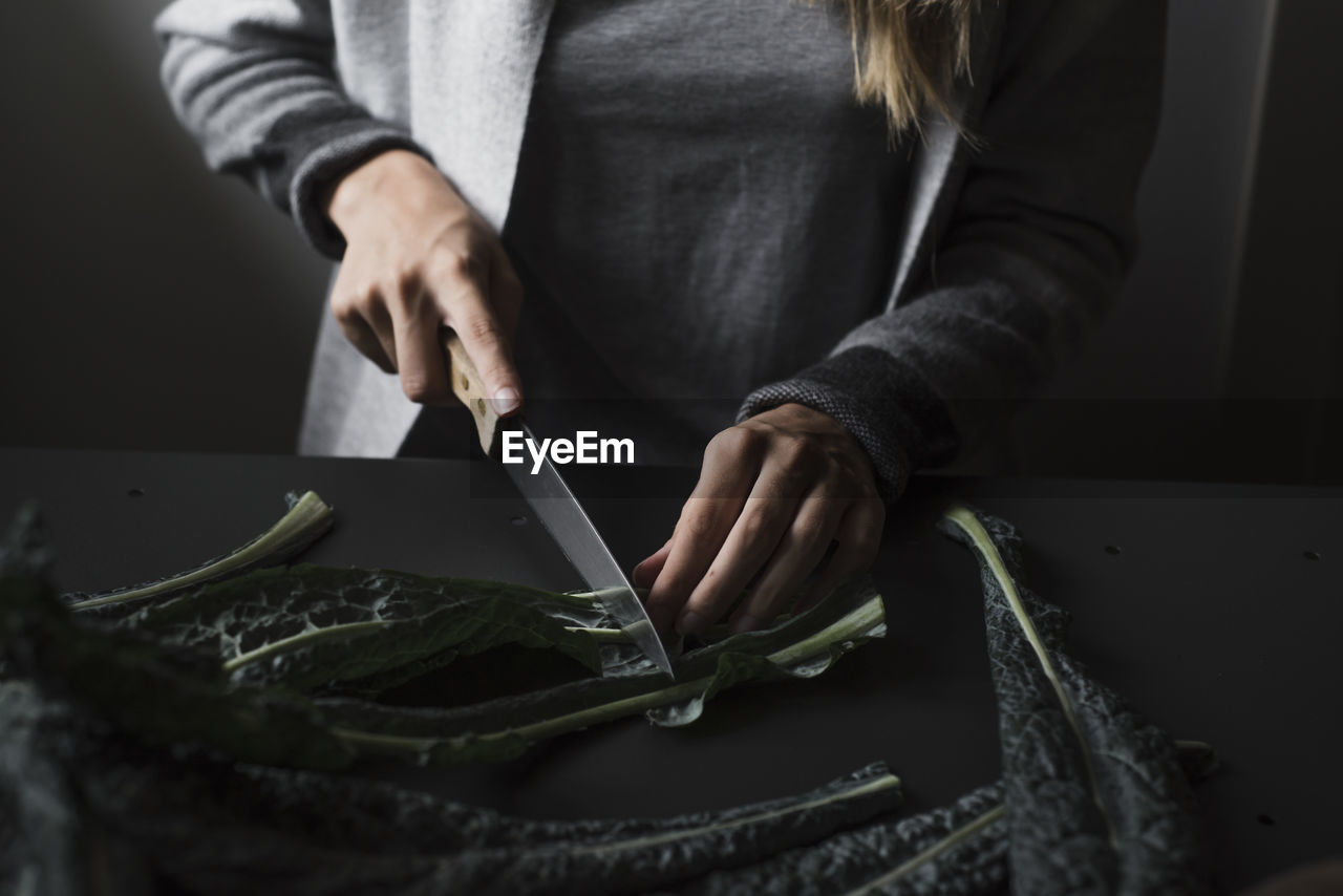 Midsection of woman preparing food