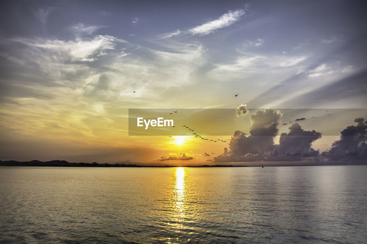 Scenic view of sea against sky during sunset