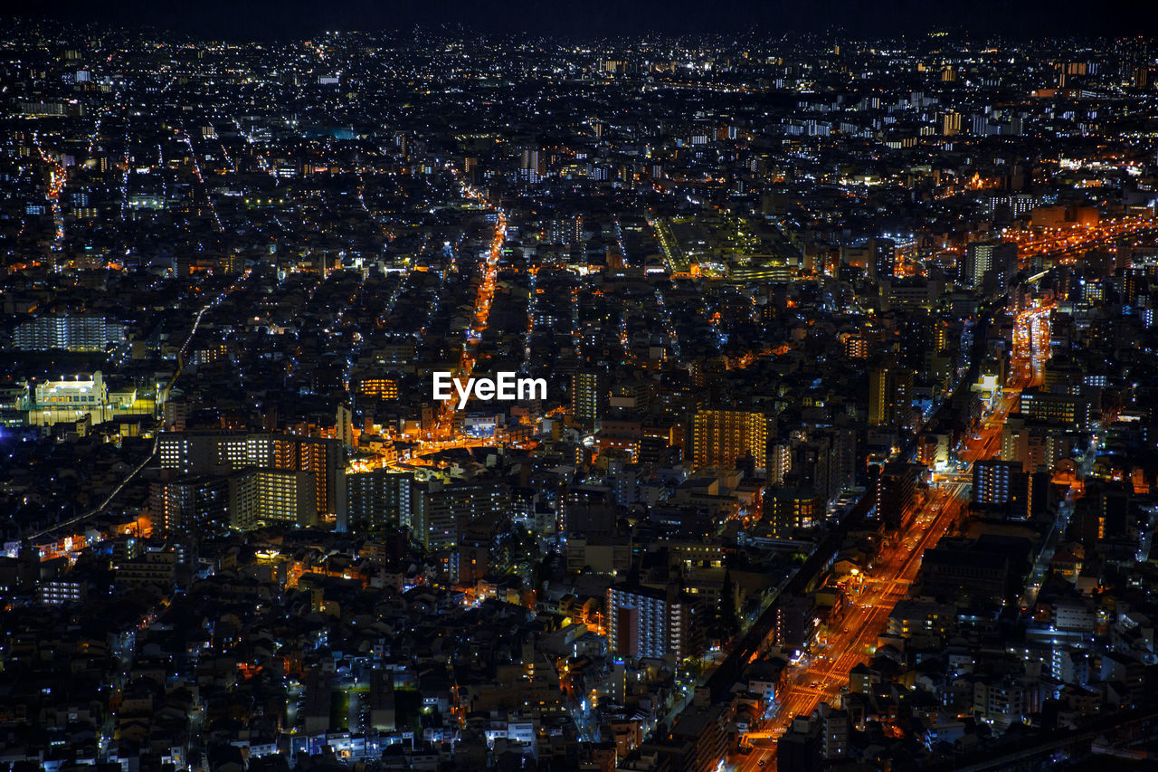 Aerial view of illuminated city at night