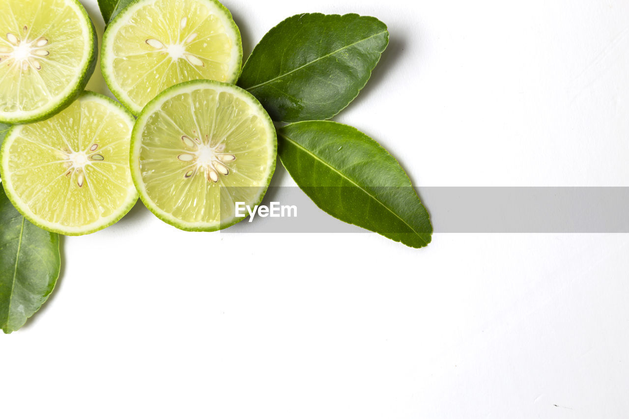 HIGH ANGLE VIEW OF FRUITS IN WHITE BACKGROUND