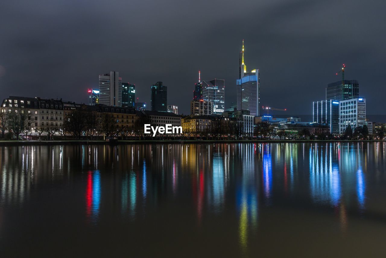 Illuminated city at waterfront