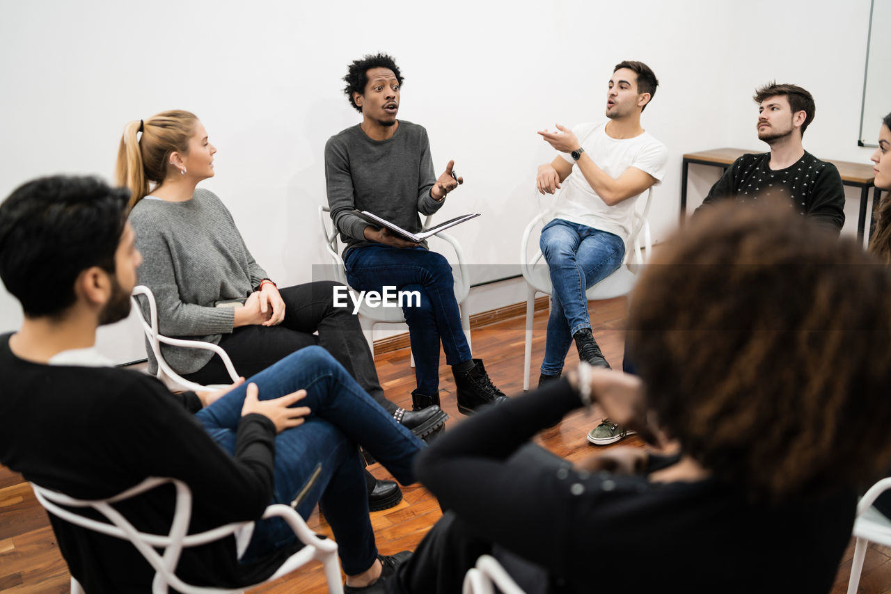 Coworkers discussing in meeting