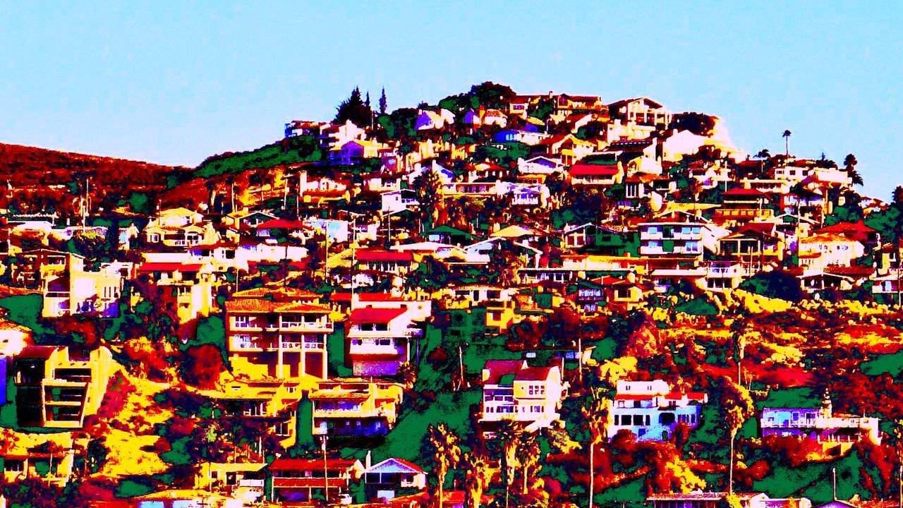 VIEW OF RESIDENTIAL DISTRICT AGAINST BLUE SKY