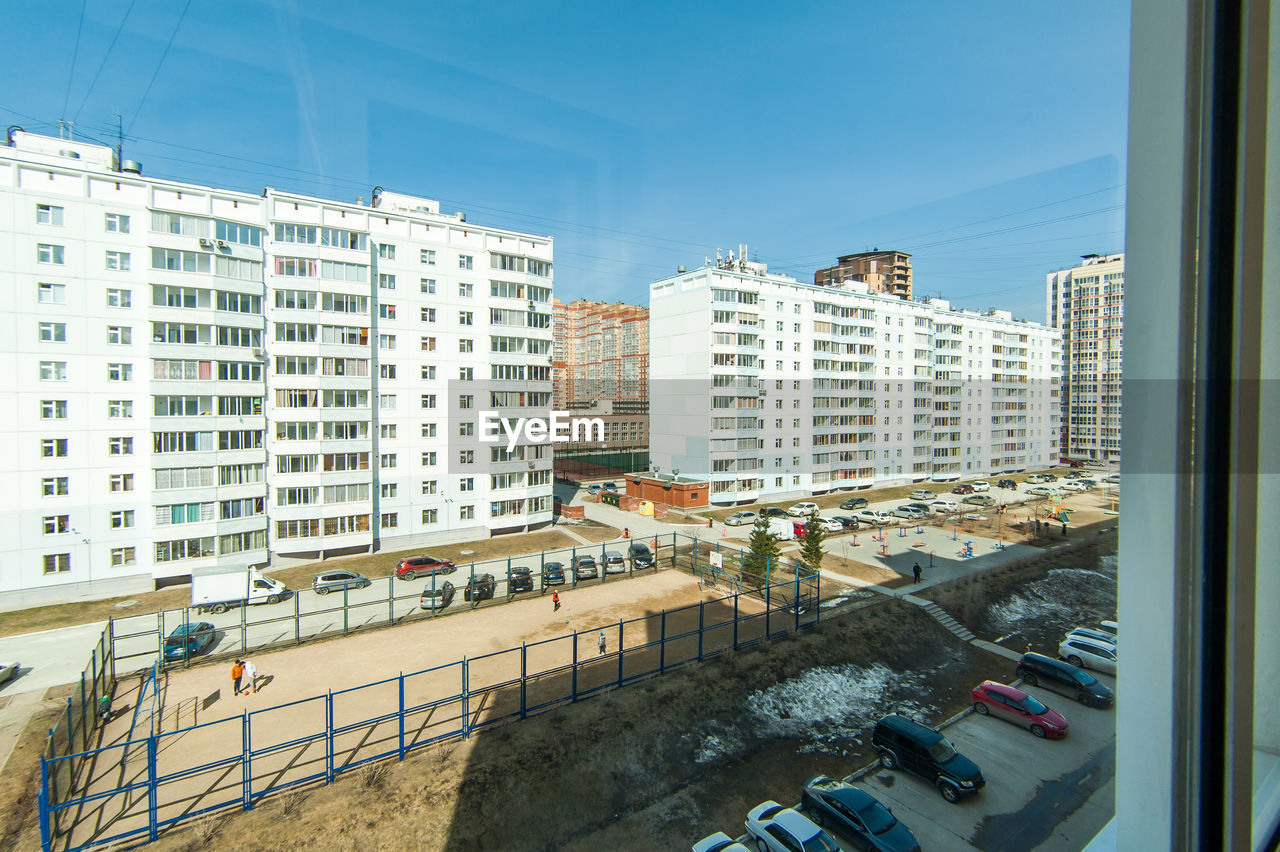 High angle view of buildings in city against sky