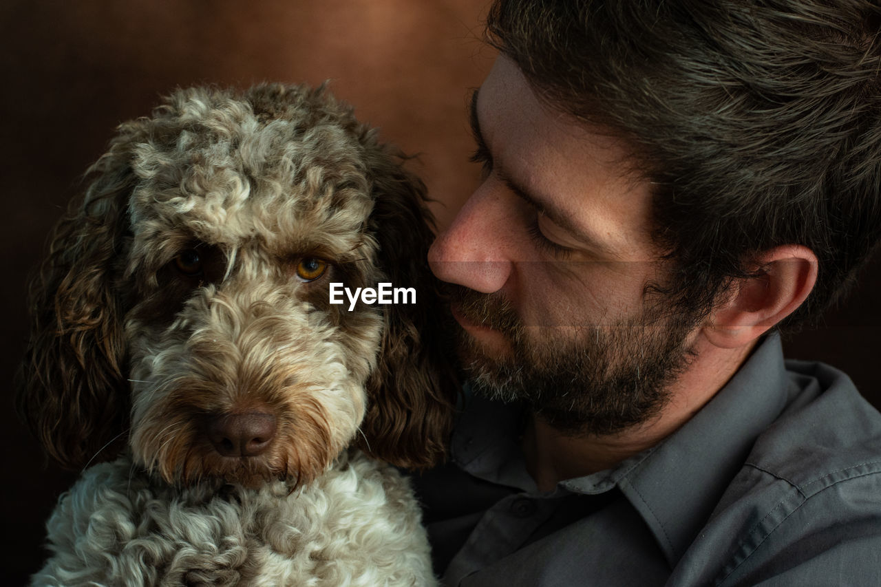 Close-up of man with dog