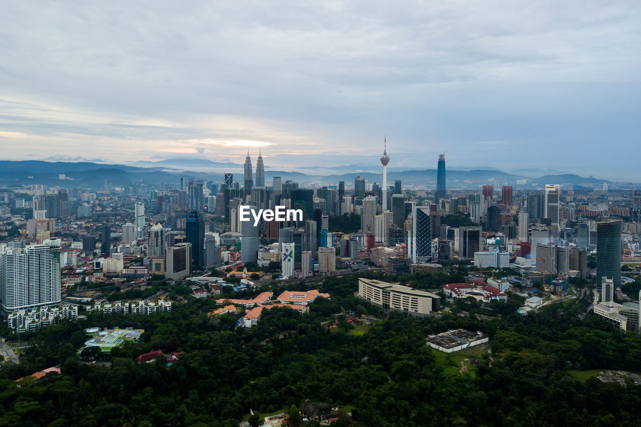 High angle view of modern buildings in city against sky