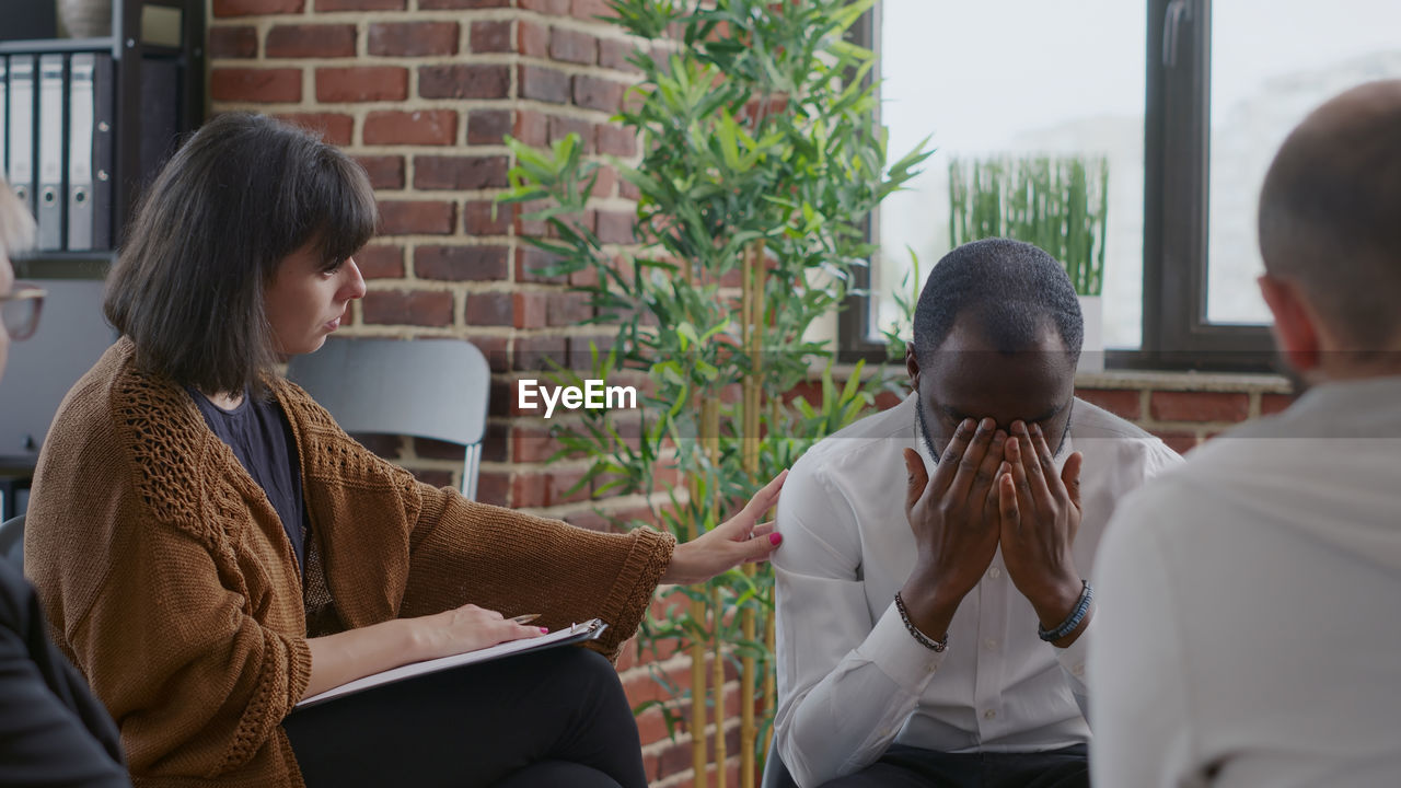 Therapist talking with patient at centre