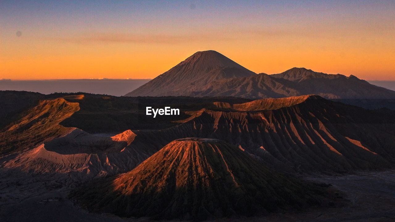 View of volcanic mountain during sunset