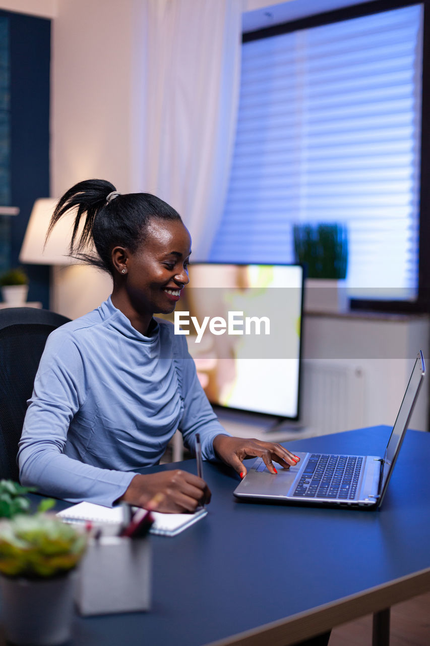 Young businesswoman working at office