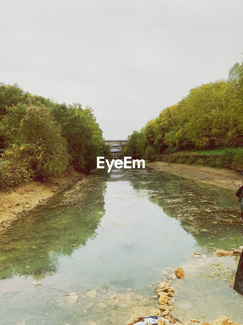 Scenic view of canal against clear sky