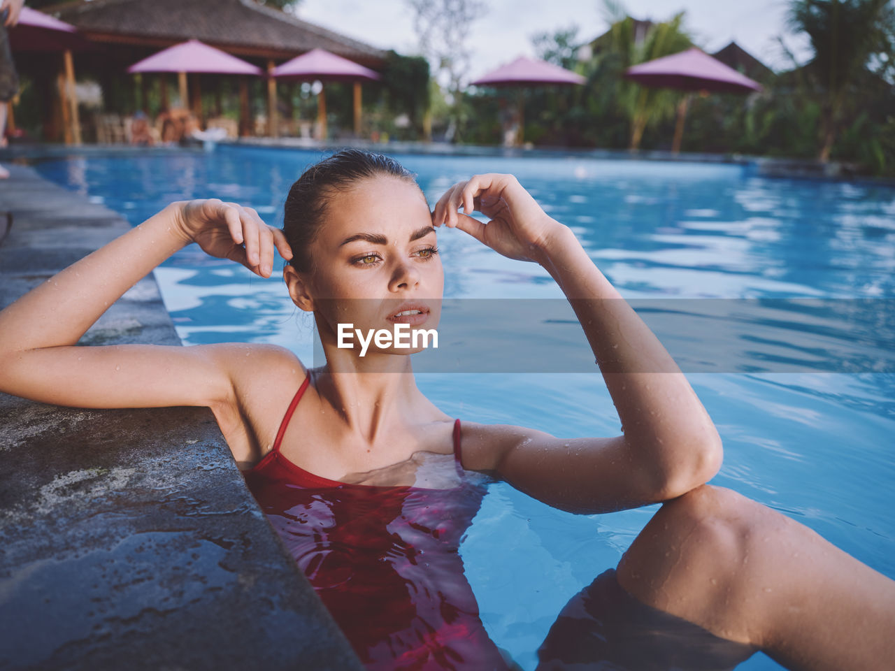 Portrait of young woman in swimming pool