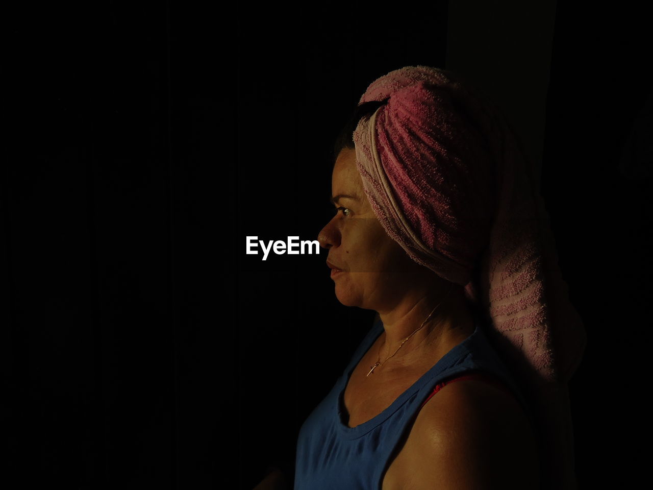 Close-up of woman with towel on head