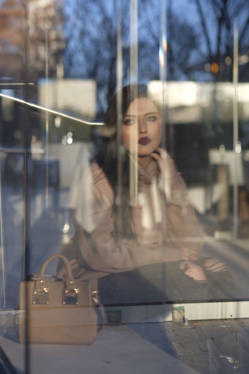 Woman looking at camera in city