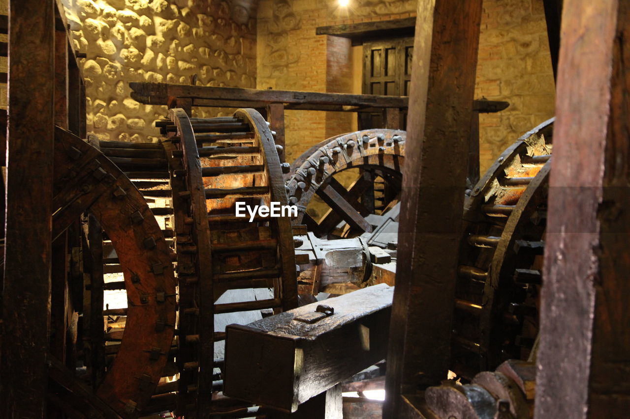 Old wooded wheel in abandoned factory