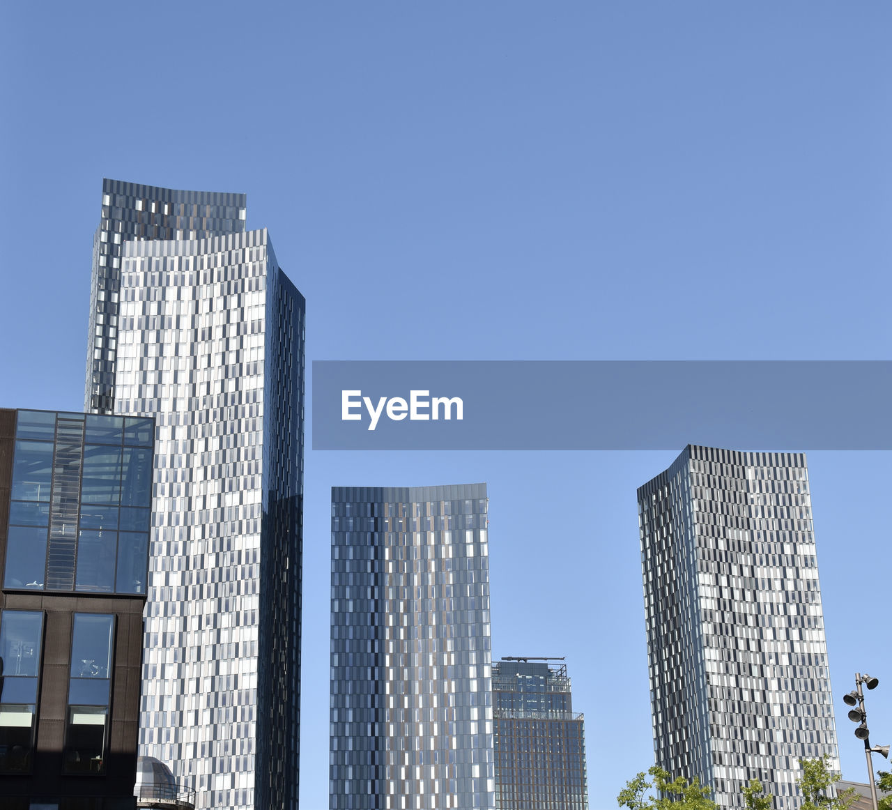 LOW ANGLE VIEW OF BUILDINGS AGAINST CLEAR SKY