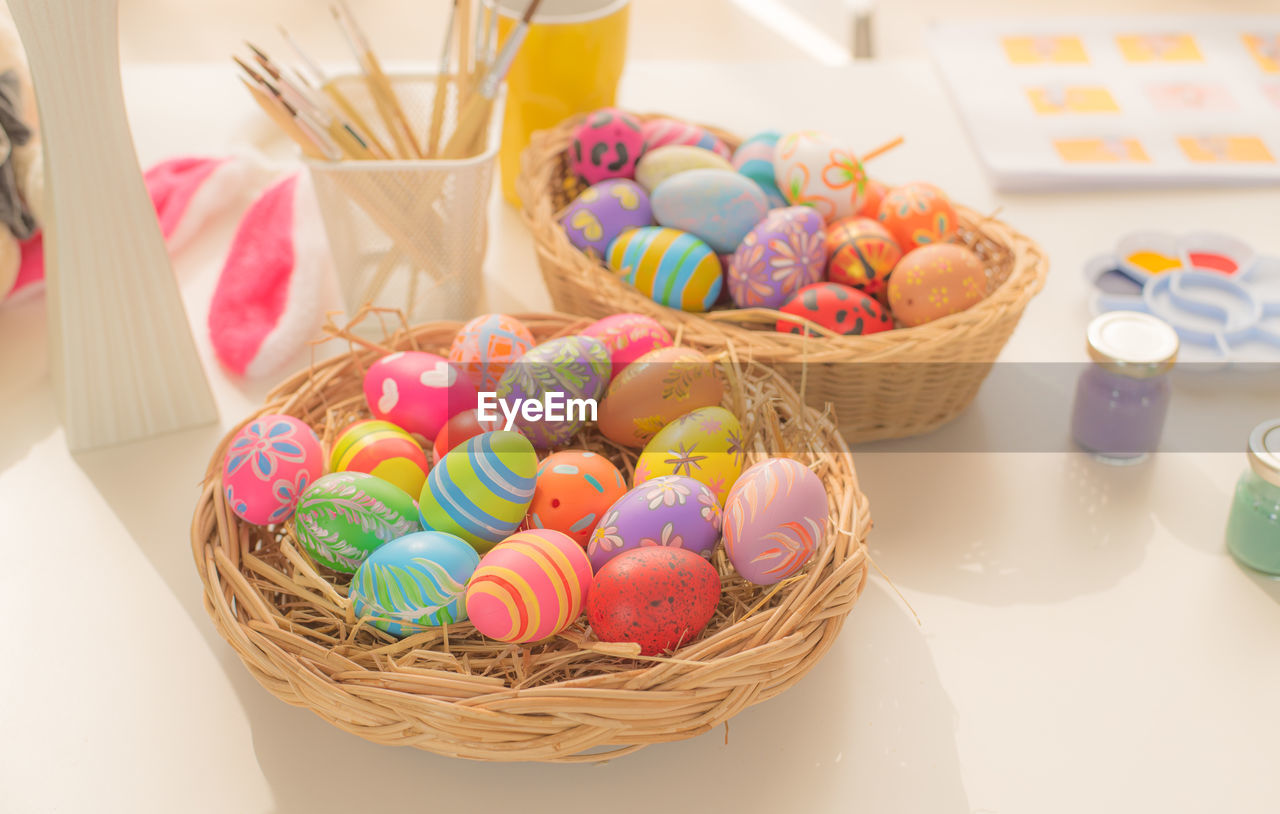 High angle view of multi colored candies in basket on table