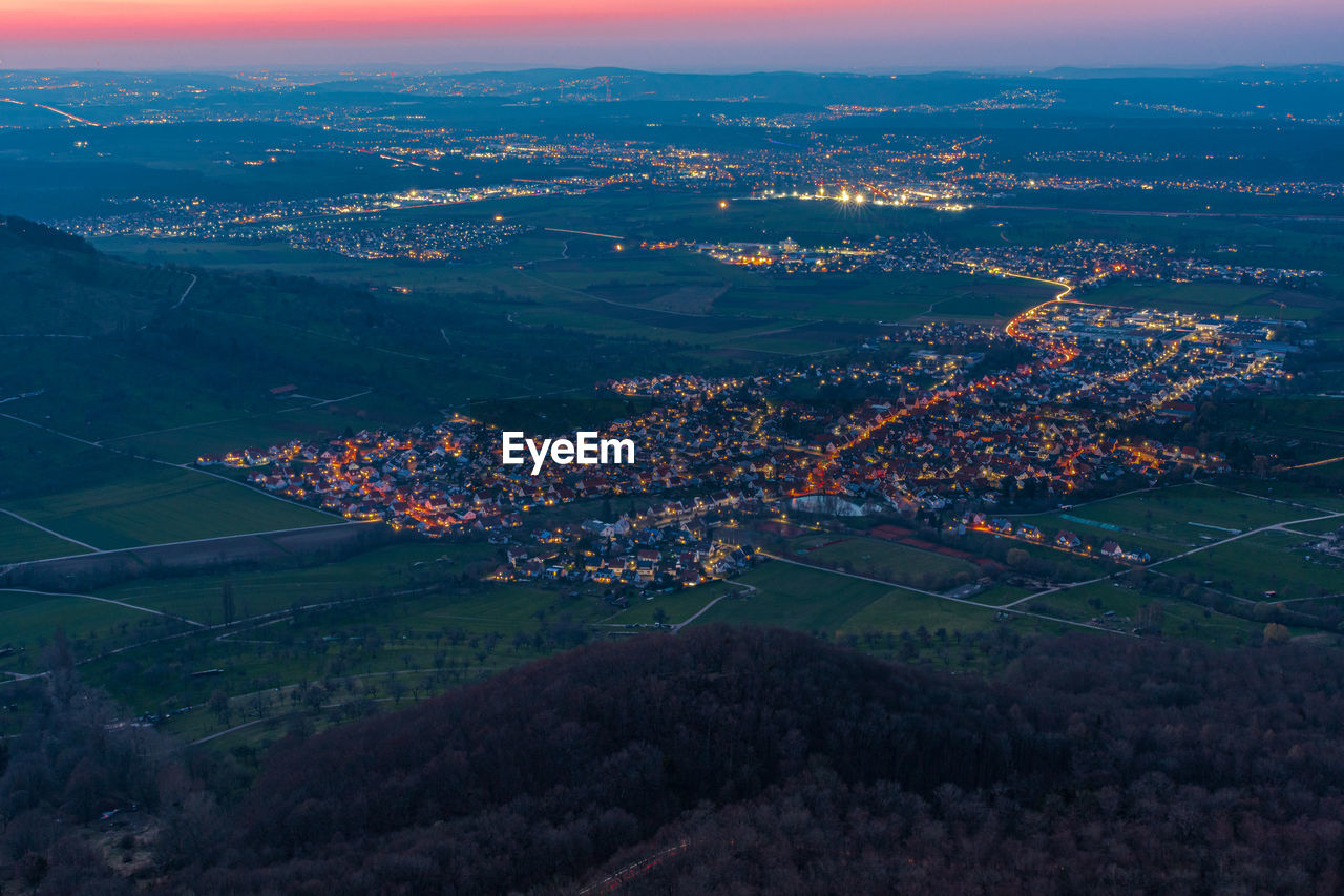 High angle view of illuminated buildings in city