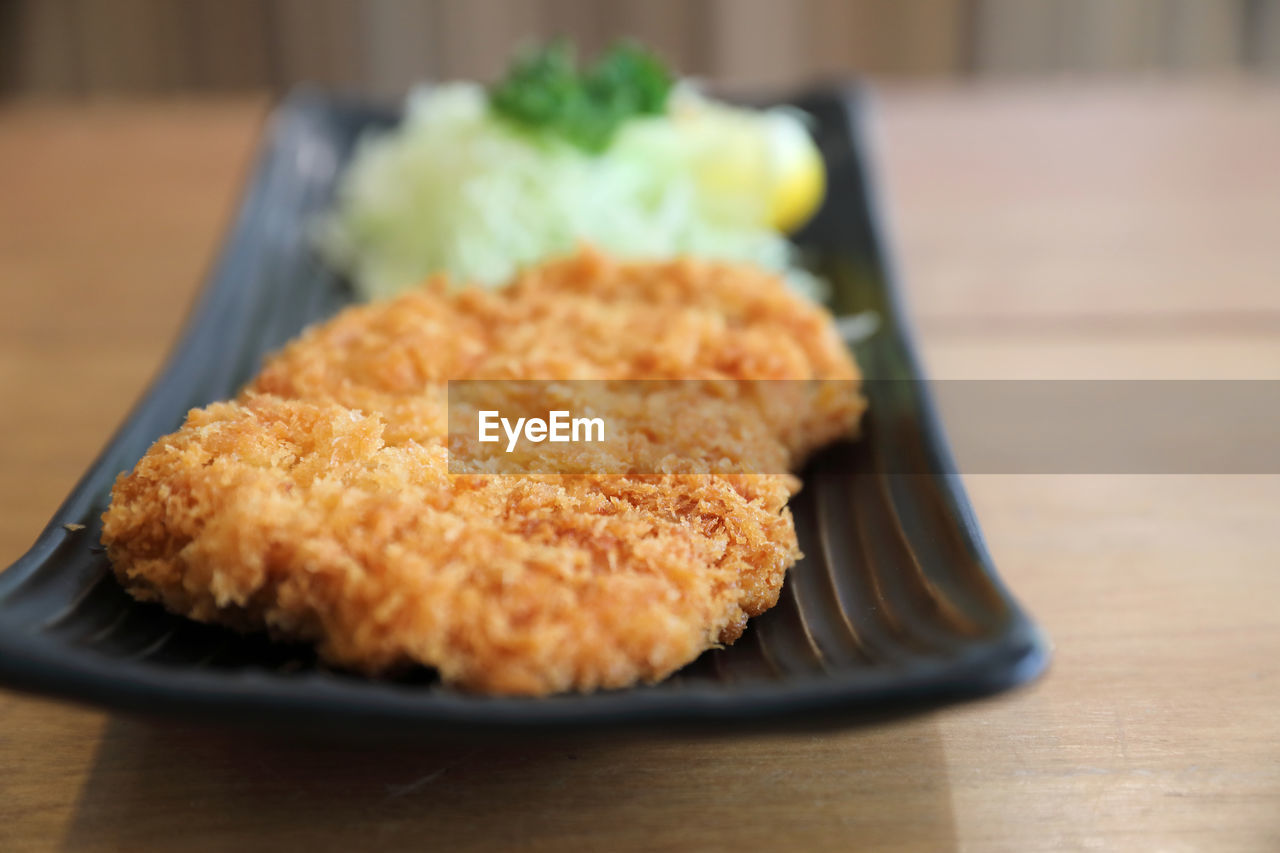 CLOSE-UP OF SERVED FOOD ON TABLE