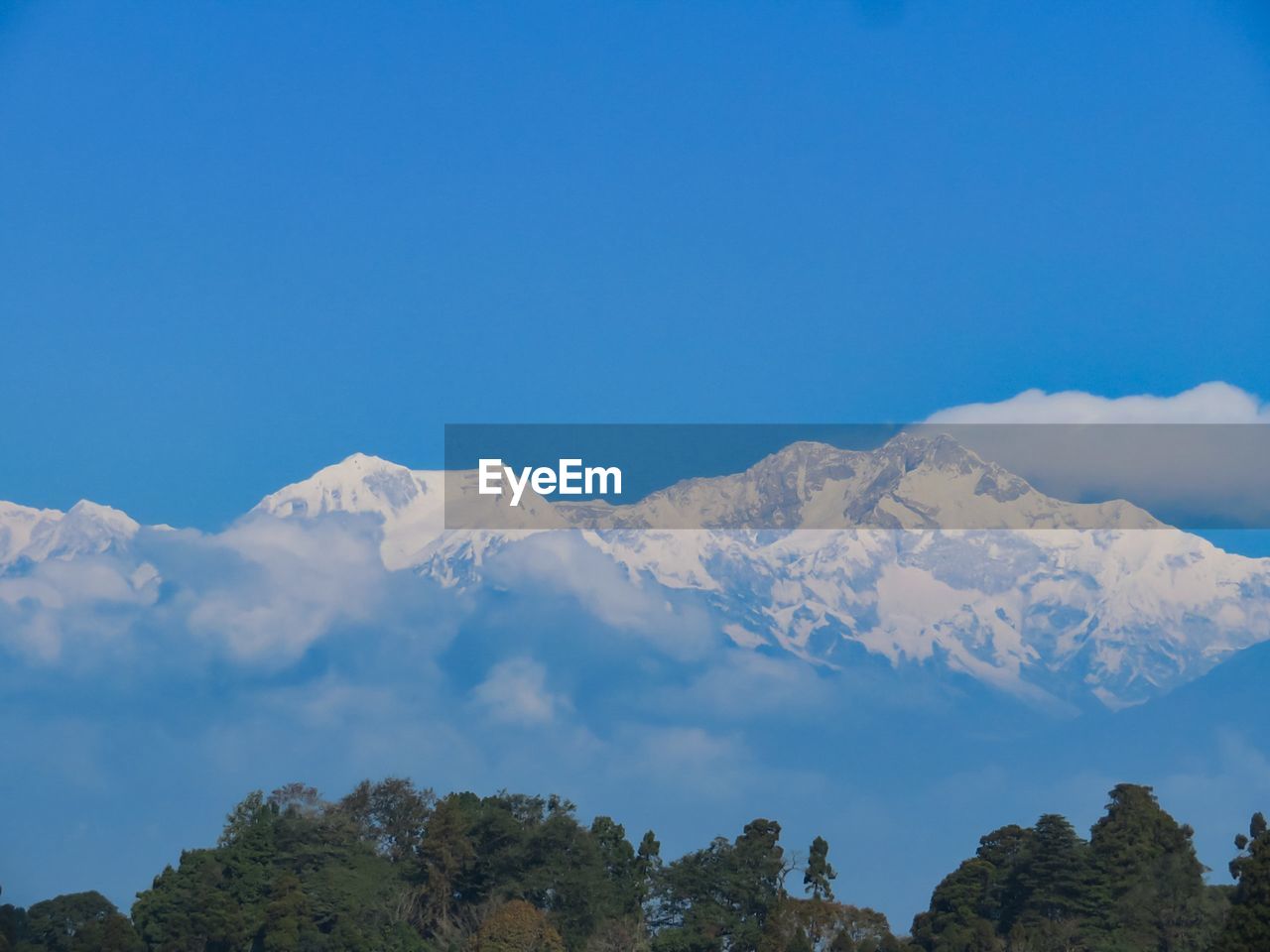 Low angle view of mountains against clear blue sky