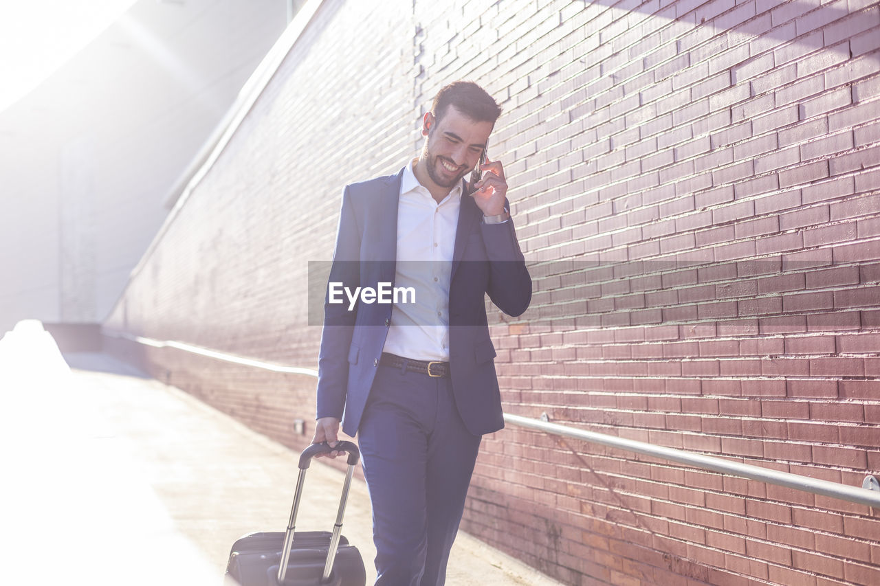 Businessman with suitcase taking a business trip