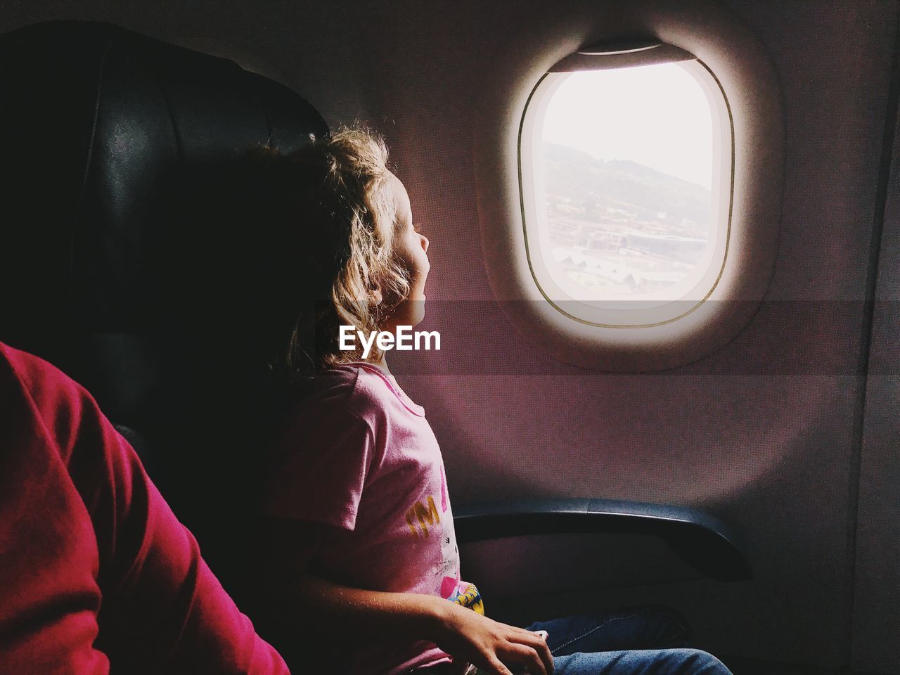 Girl sitting in airplane