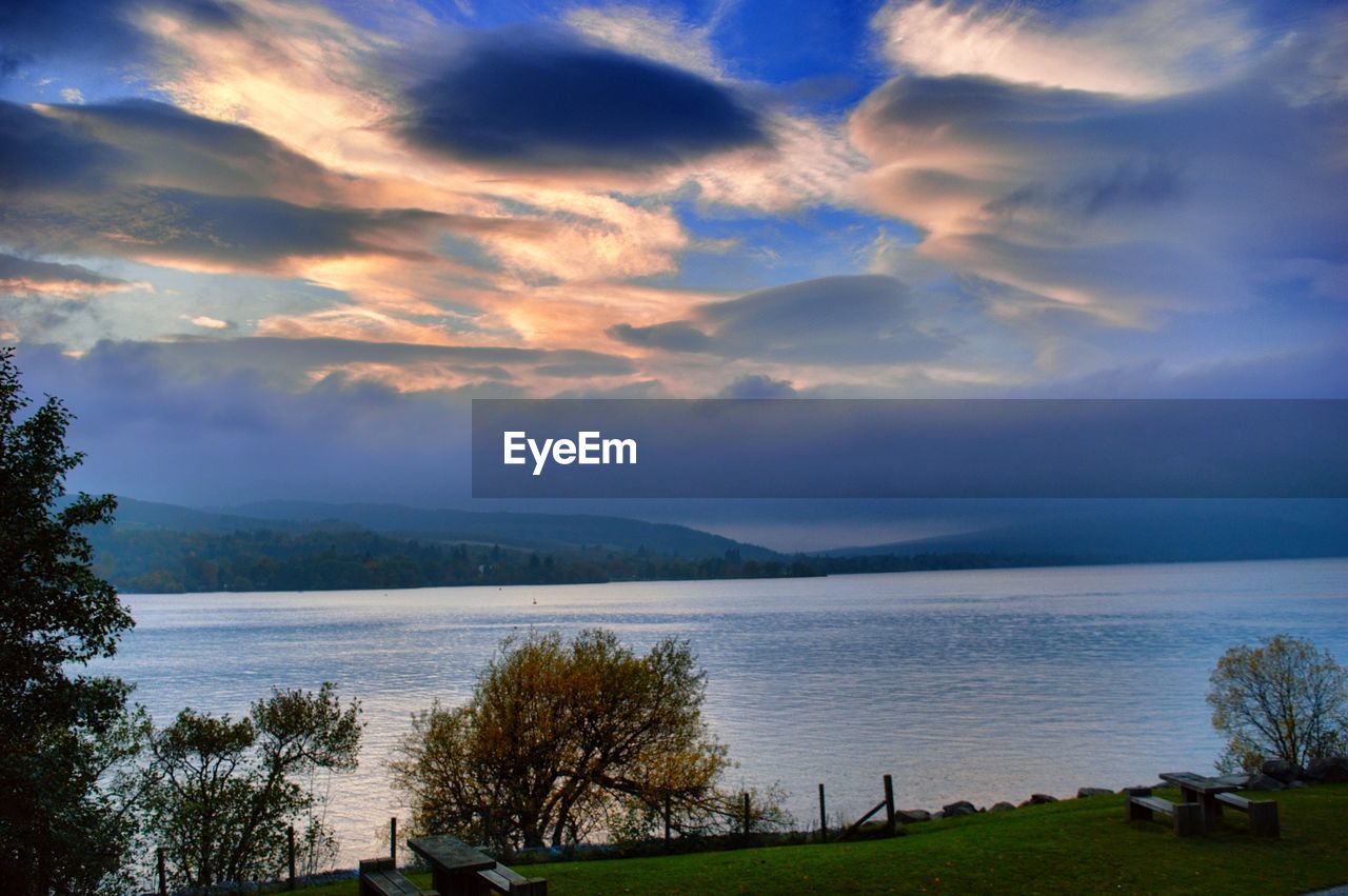 Sea against cloudy sky at dusk