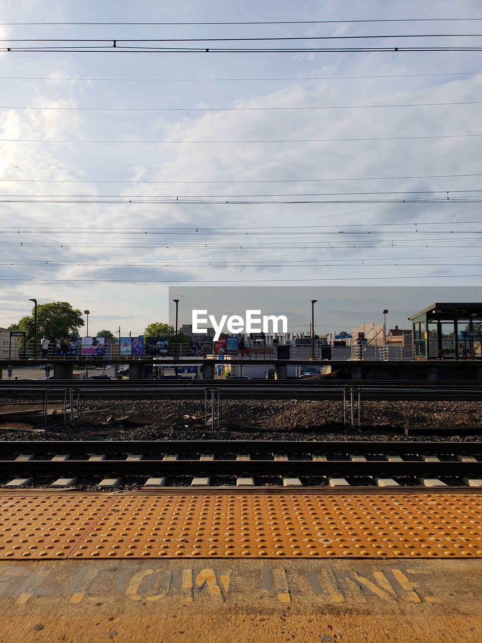 Train at railroad station against sky