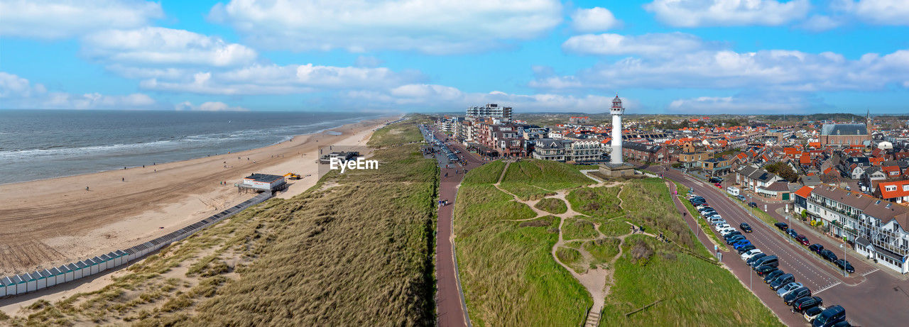 high angle view of people walking on beach against sky