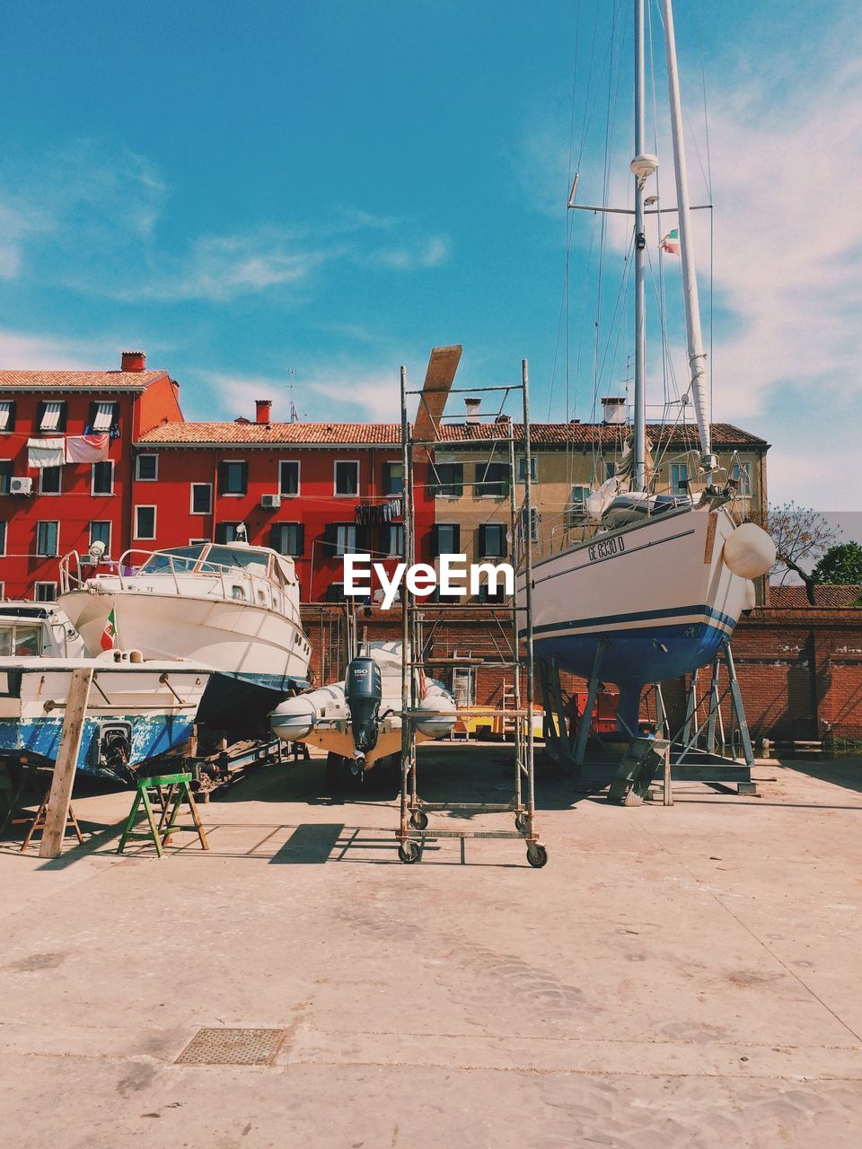 Boats moored against buildings