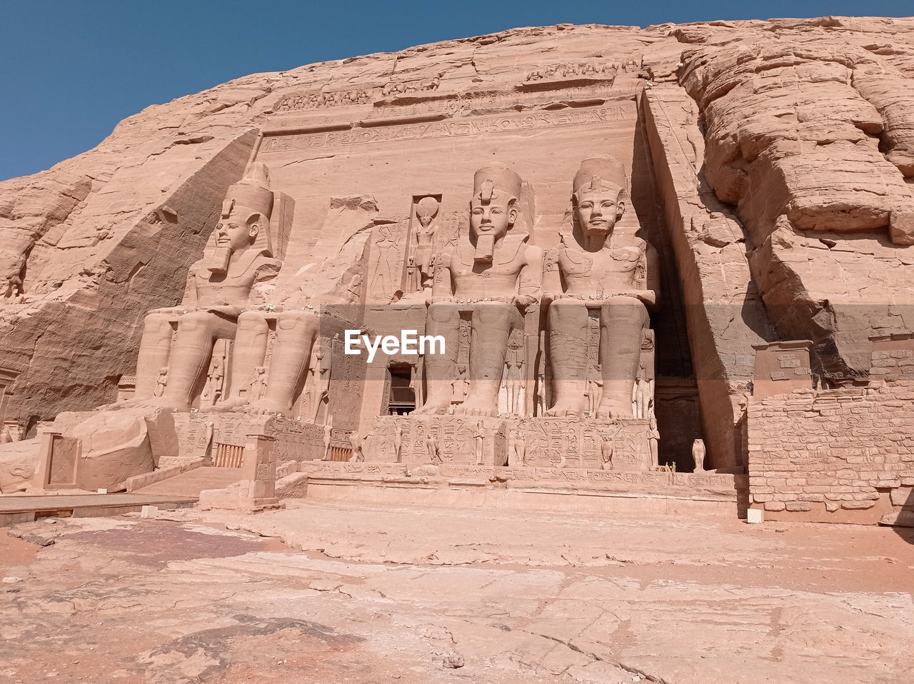 Abu simbel, an ancient tomb carved on the stone with statues in egypt, africa