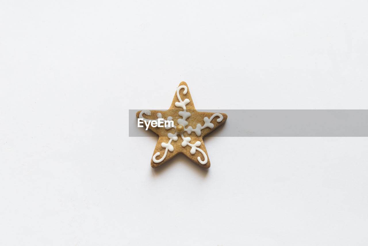 Directly above shot of star shaped cookie on gray background