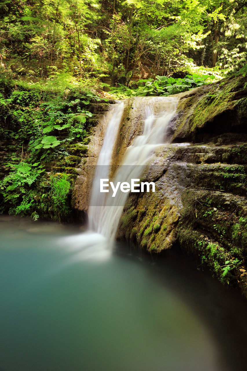 SCENIC VIEW OF WATERFALL