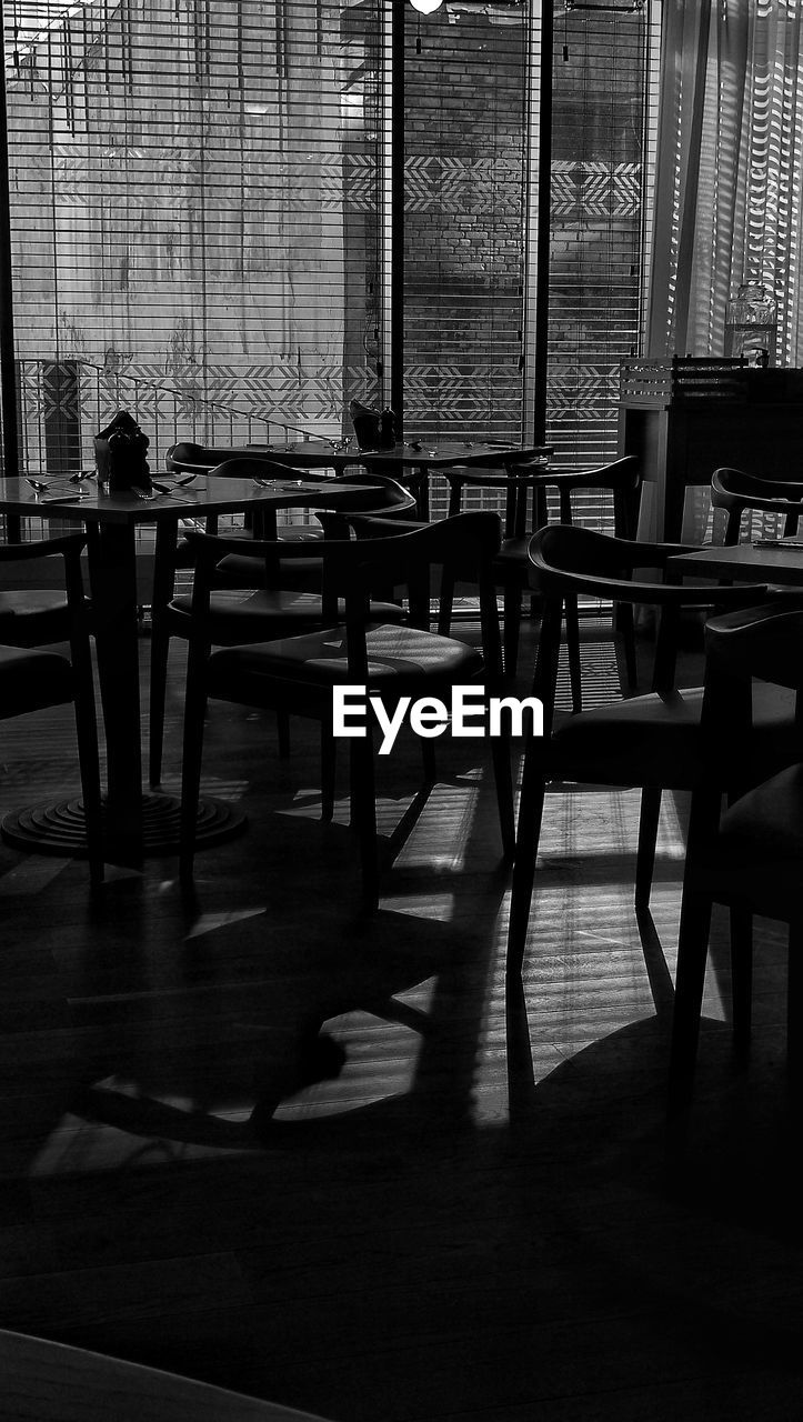 CHAIRS AND TABLE IN CAFE