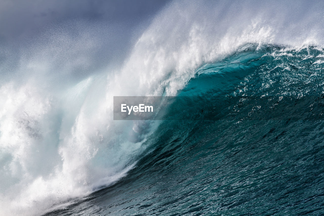 Scenic view of waves against sky