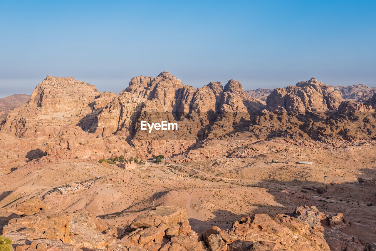 Scenic view of rocky mountains against clear sky