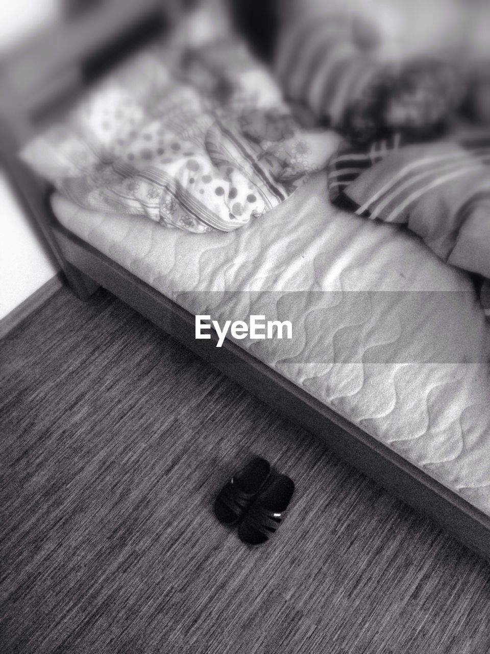 Flip flops beside bed