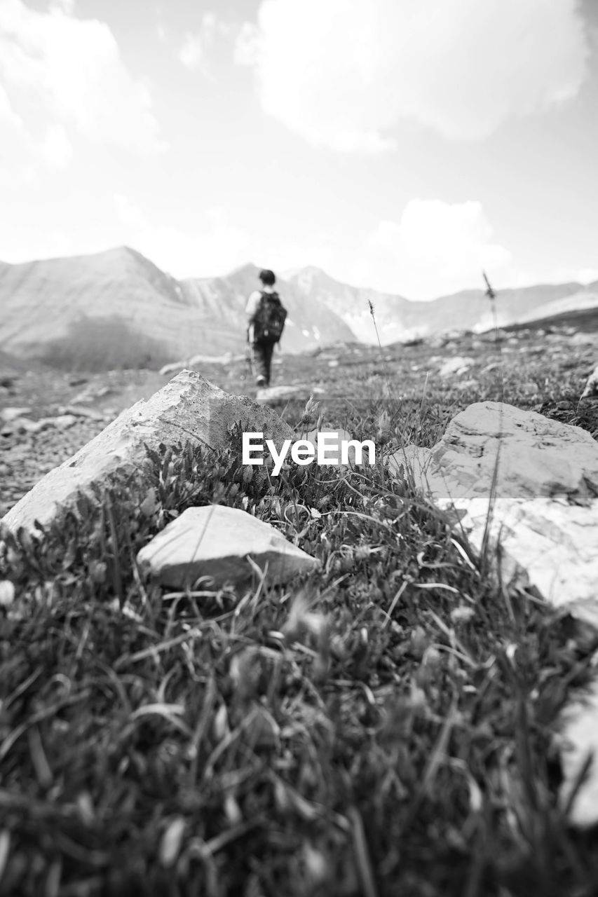 Mid distance view of boy standing on land