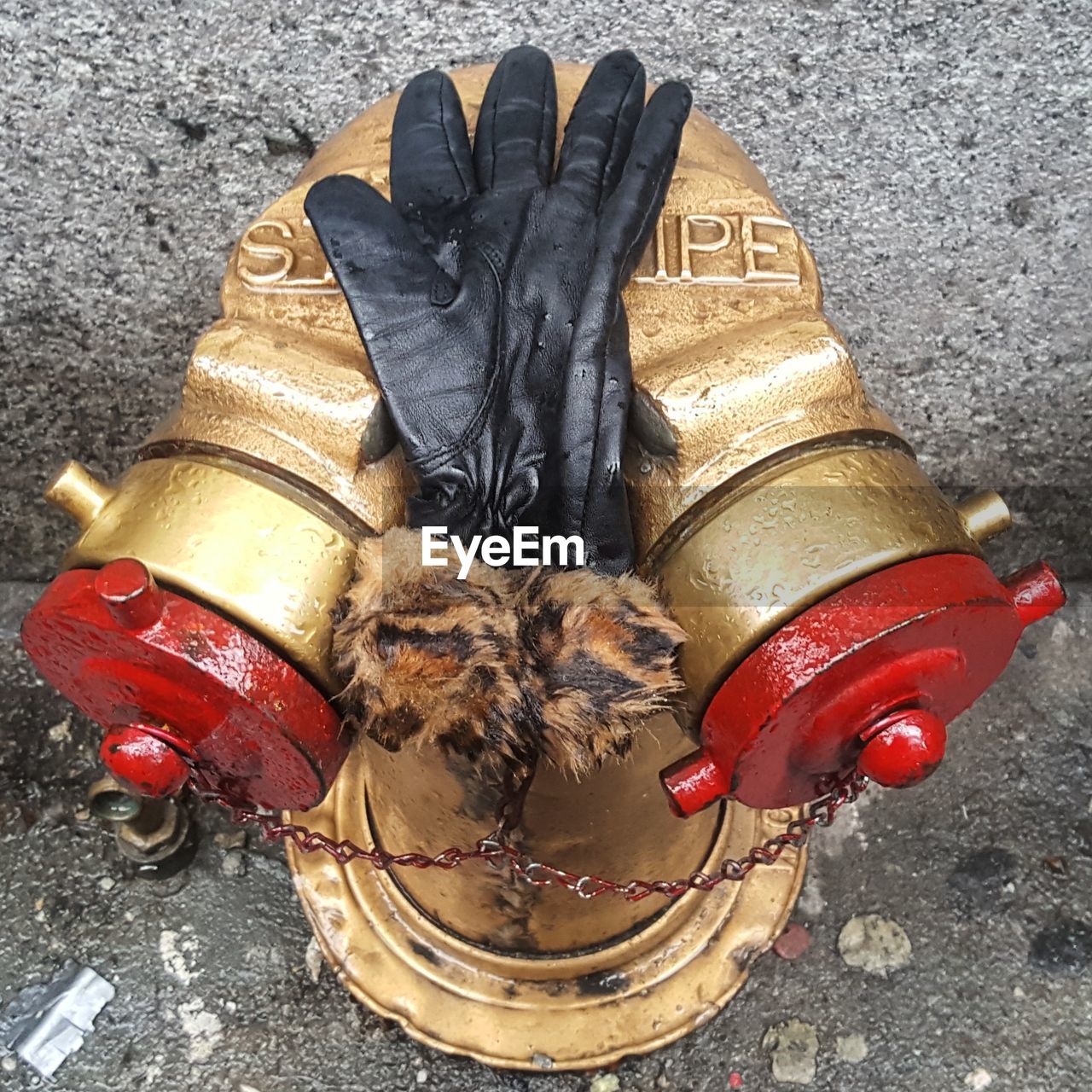 High angle view of gloves on water pipe