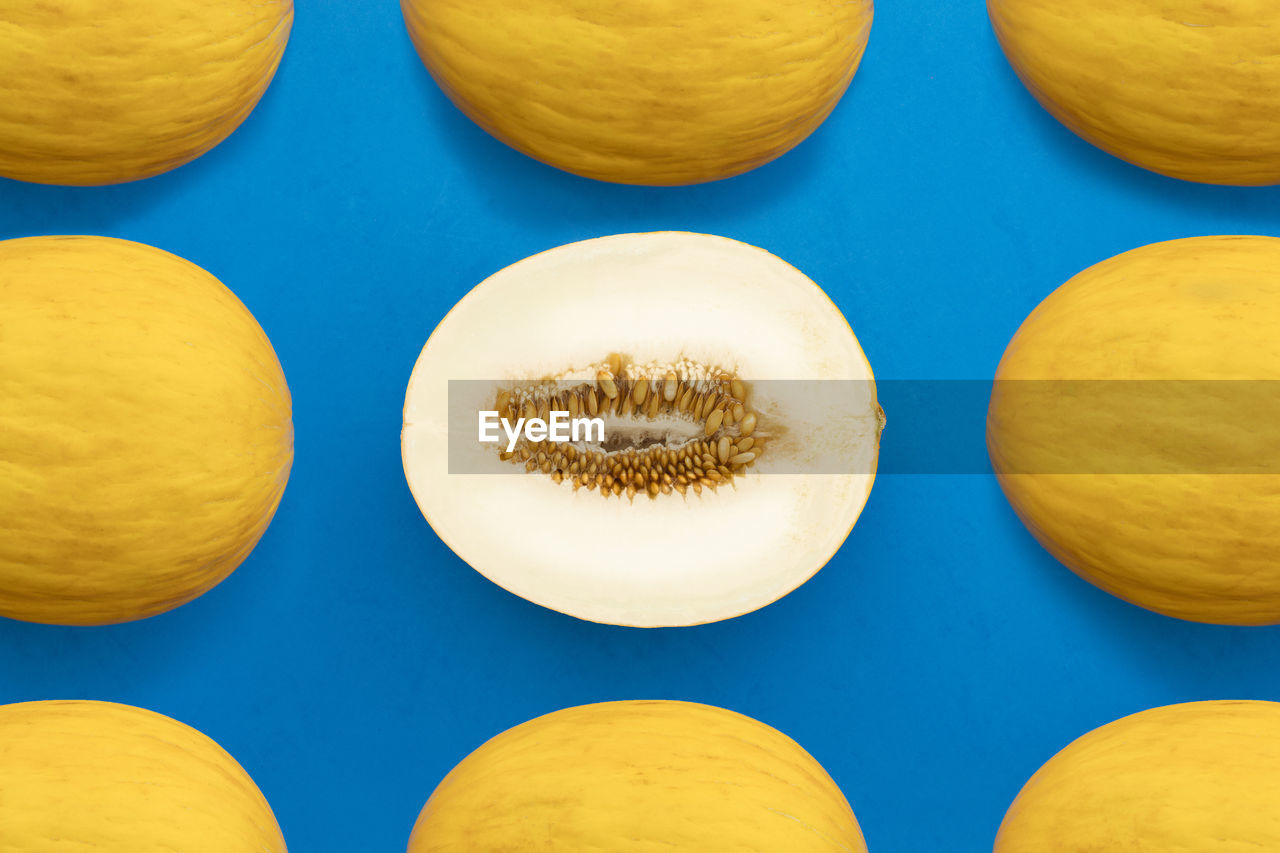 Full frame shot of melons on blue background