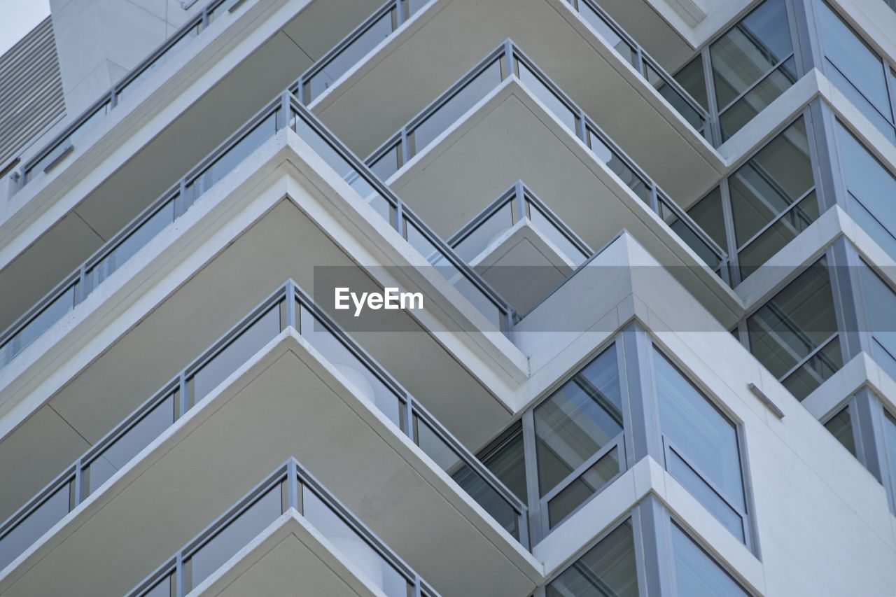 Abstract angles are seen from a low angle of the balconies of a high rise building